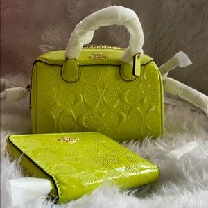 Neon green mini coach purse with matching wallet.